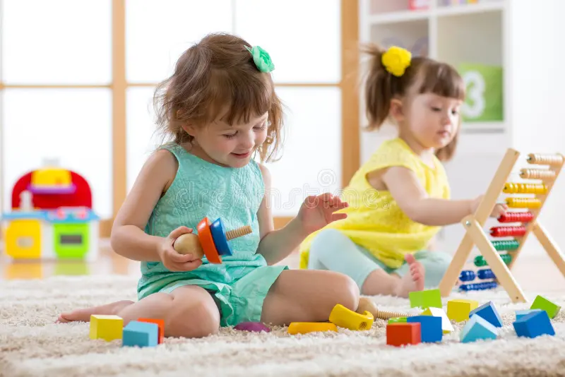kids-girls-engaging-daycare-two-toddler-children-playing-educational-toys-kindergarten-109927653